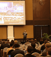 Master Dominique Saatenang standing in front of people during a conference